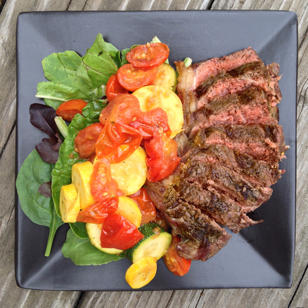 New York Strip Steaks with Late Summer Veggies on Salad