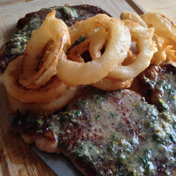 Rib-Eye Steaks with Onion Rings and Blue-Cheese Butter
